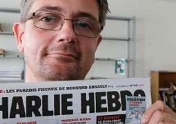 Charlie Hebdo поместил на обложку пророка Мухаммеда с плакатом "Я - Шарли"