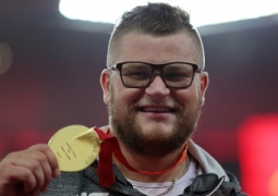 Польский атлет расплатился медалью в такси Пекина