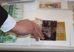 Крупную сумму фальшивых денег изъяли полицейские в Алматы 