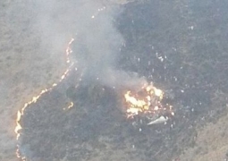 Опубликованы фото с места крушения пассажирского самолёта в Пакистане